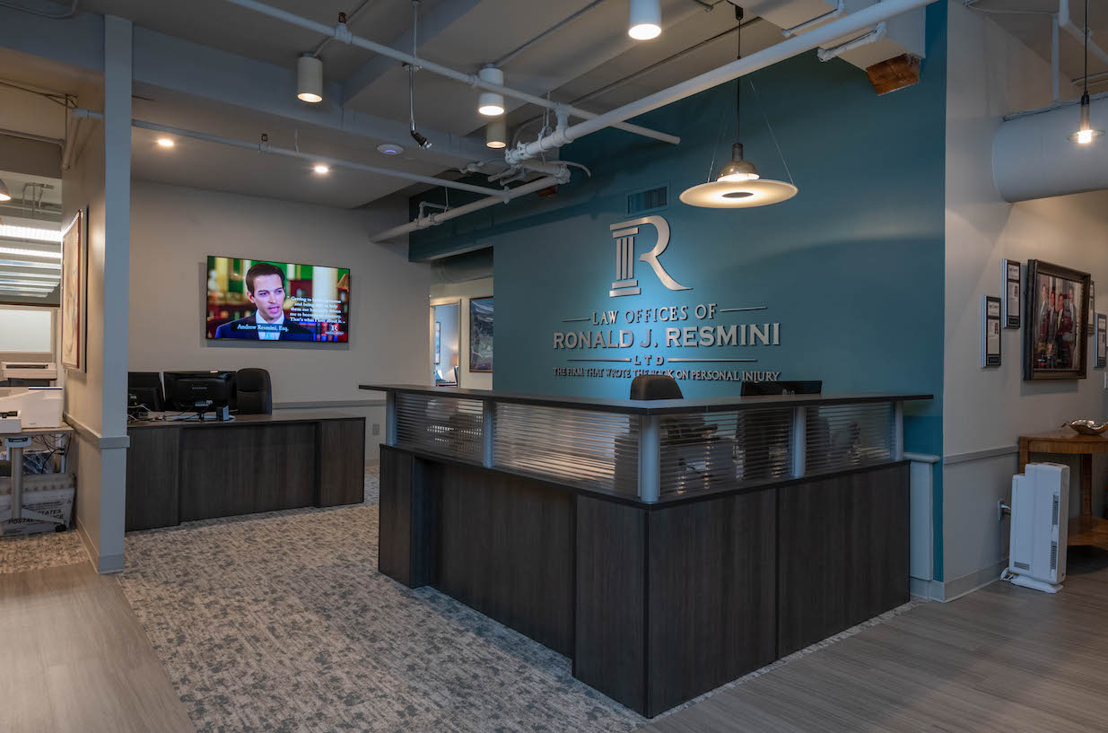 photo of main lobby at the law offices of ronald j. resmini, tv in background